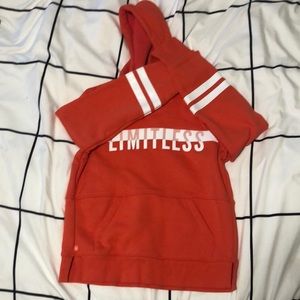 Orange Athleta Girl sweatshirt.